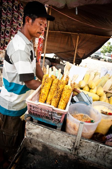 street vendor selling corn on the street