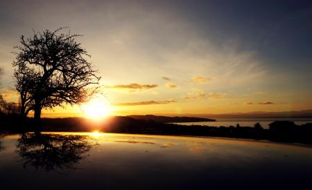 Sunrise over Body of Water Under Blue Sky