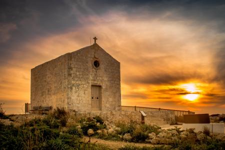 Sunset behind an old church