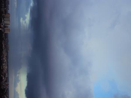 Tall cloud raining its shower