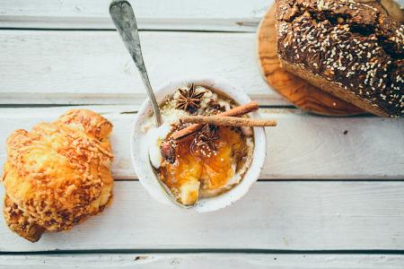 Three Assorted Dressed Foods on White Wooden Surface