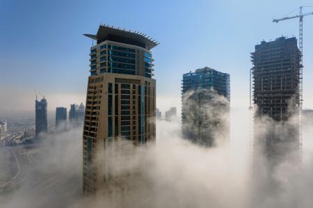 Three Brown High Rise Buildings