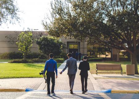 Three Man Walking on Street Wearing Suit Jackets