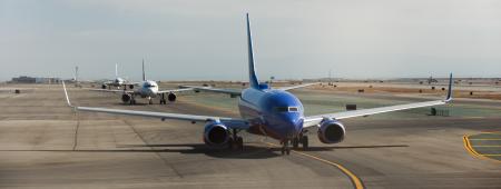 Three planes waiting in line for takeoff at SFO