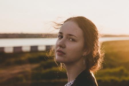 Tilt Shift Lens Photography of Woman during Sunset