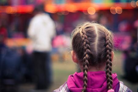 Tilt Shifting Lens Photography of Girl in Purple and White Hoodie Staring at Man in White Shirt