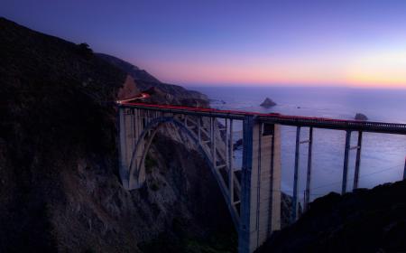 Time Lapse Photography of Cars Running on Bridge Near Ocean