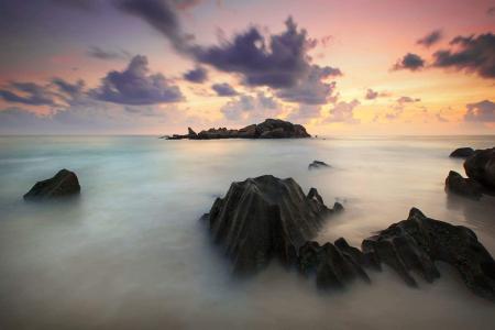 Time Lapse Photography of High Rise Mountain Covered With Clouds