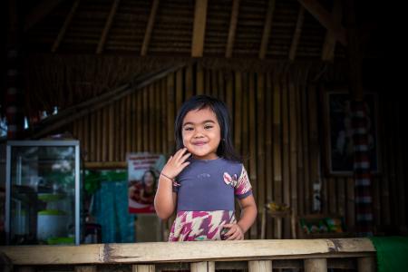 Toddler in Purple and White Dress