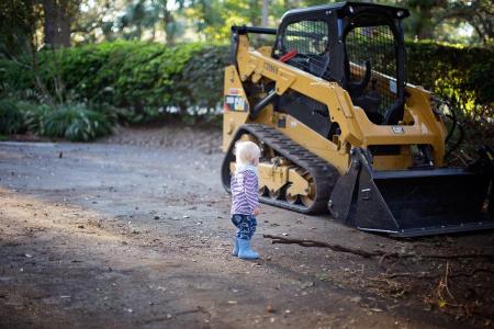 Toddler Stand Beside Front Loader