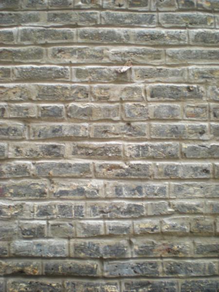 Tuckpointed Vertical Light Brick Wall