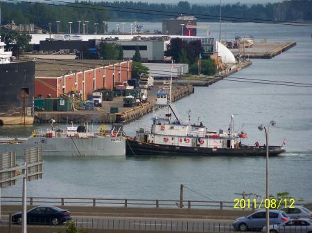 Tug and notch barge entering the Keating Channel, Toronto, -g