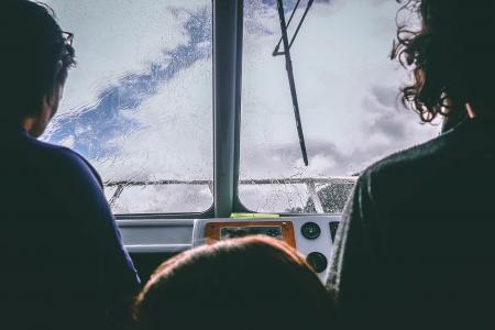 Two Person Facing in Front of the Glass