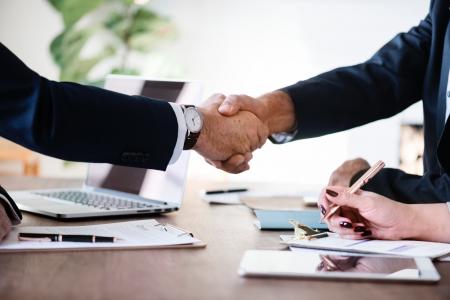 Two Person in Formal Attire Doing Shakehands