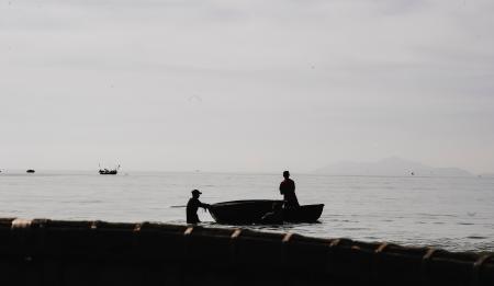 Two Person Riding Boat on Body of Water