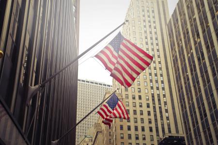 Two U.s.a. Flags Under White Clouds at Daytime