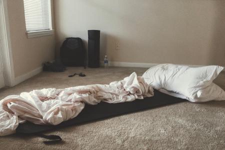 Two White Rectangular Pillows With White Blanket on Floor