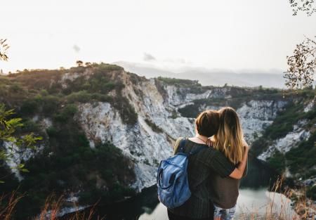 Two Woman Standing on the Ground and Staring at the Mountain