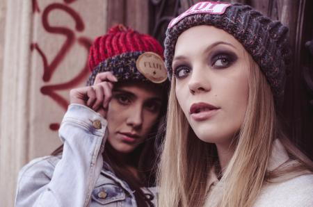 Two Women in Beanie Caps Taking Selfie