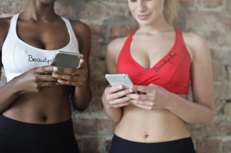 Two Women Uses Smartphones