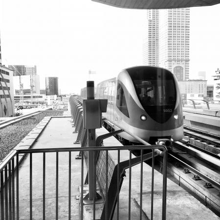 View Of Buildings And Train In Black And White