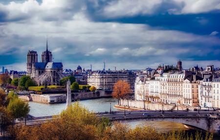 View of Cityscape Against Cloudy Sky