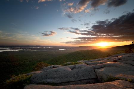 View of Green Grass Land and Sunset during Daytime