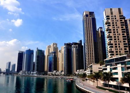 View of Skyscrapers Against Cloudy Sky