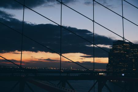 View of Suspension Bridge Against Cloudy Sky