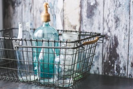 Vintage empty bottles in metal basket