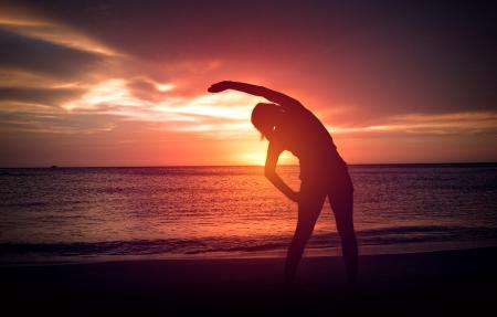 Warm-Up exercise on the Beach at Sunset