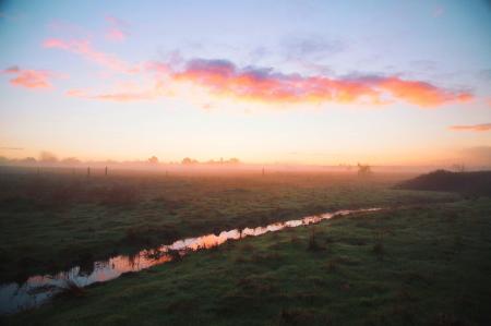 Water River Between Green Grass Field during Daytime