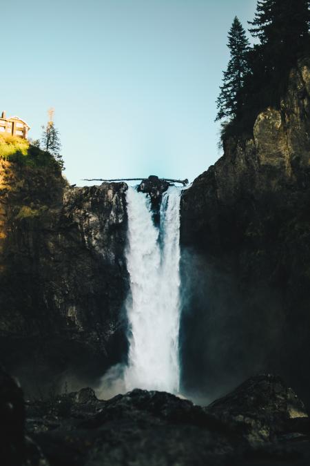 Waterfalls Near House Under Clear Blue Sky