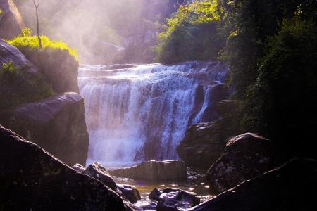 Waterfalls Surrounded by Grass and Rocks