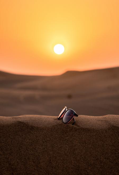 Wayfarer Sunglasses on Sand Tilt Shift Lens Photography