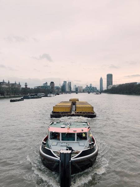 White and Black Boat on Body of Water