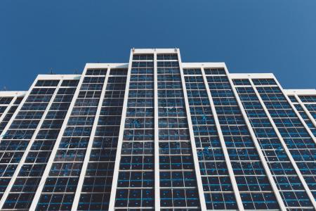 White and Blue High Rise Building Under Blue Sky during Daytime