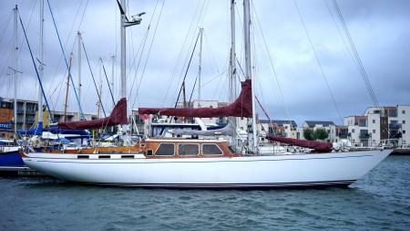 White and Brown Sail Boat on the Body of Water