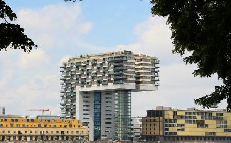 White and Gray Concrete Building Under Cloudy Blue Sky during Daytime