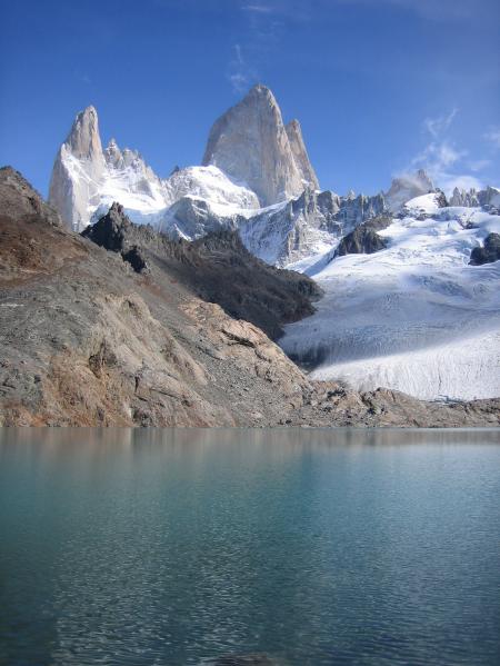 White and Gray Stone Cliff Near Body of Water during Daytime