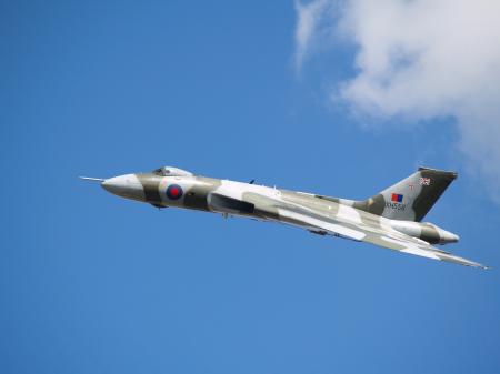 White and Grey Fighter Plane on Mid Air during Daytime