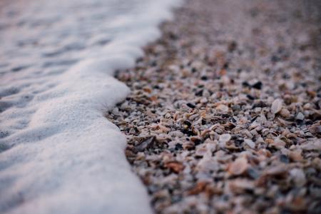 White and Grey Pebbles Near Sea Shore