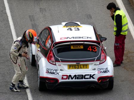 White and Red Dmack Car on Road