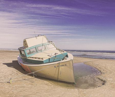 White and Teal Speedboat on Land