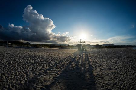 White Beach Sand Under Blue Sky during Daytime