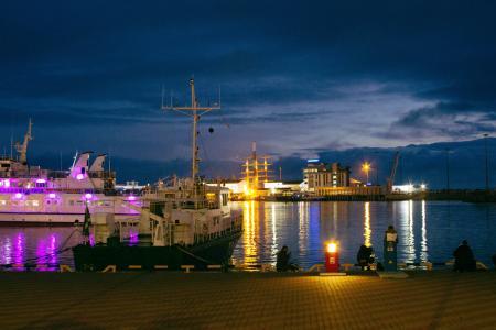 White Boat Near Dock during Nighttime