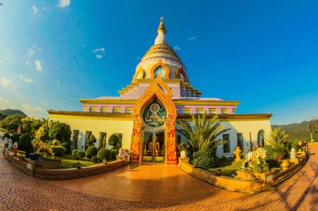 White Buddhist Temple With Blue Cloudy Background