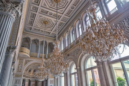 White Cathedral Hanging With Three Brown Uplight Chandelier