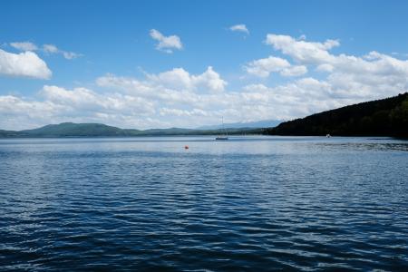 White Clouds and Blue Skies over Lake