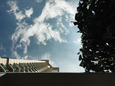 White Concrete Building With Cloudy Sky